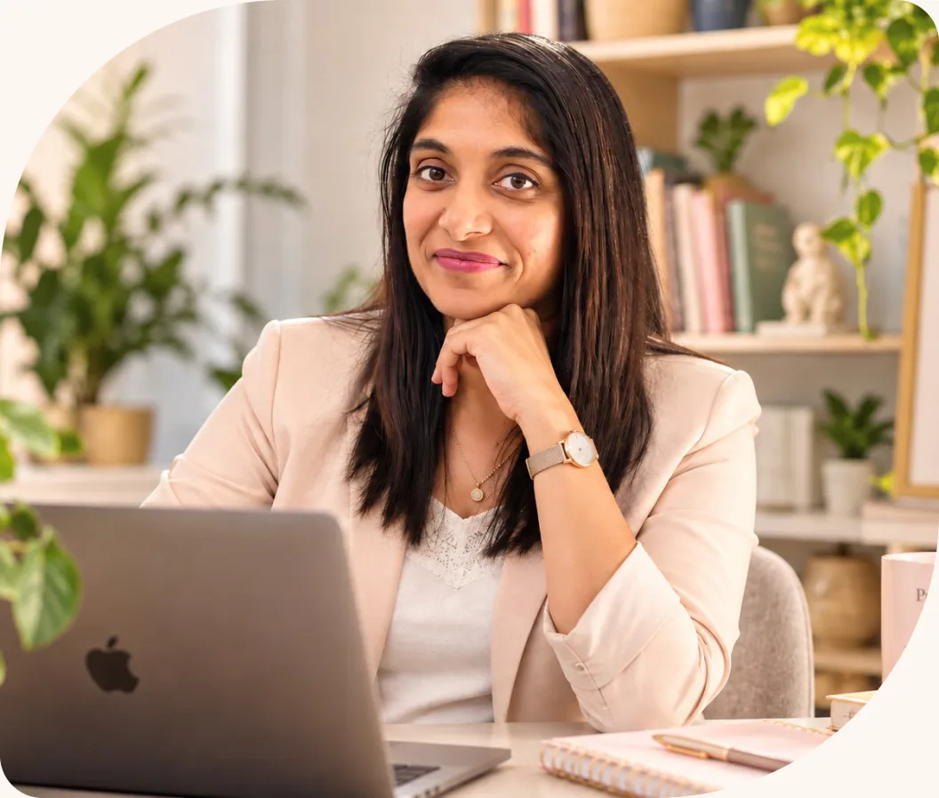 Zalak Khattri, WingsAriaa parenting coach, smiling at her desk